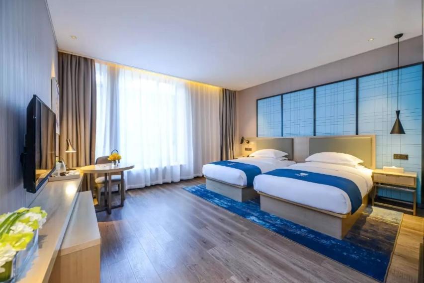 Echarm Hotel Ji'Nan Railway Station Jinan Exterior foto